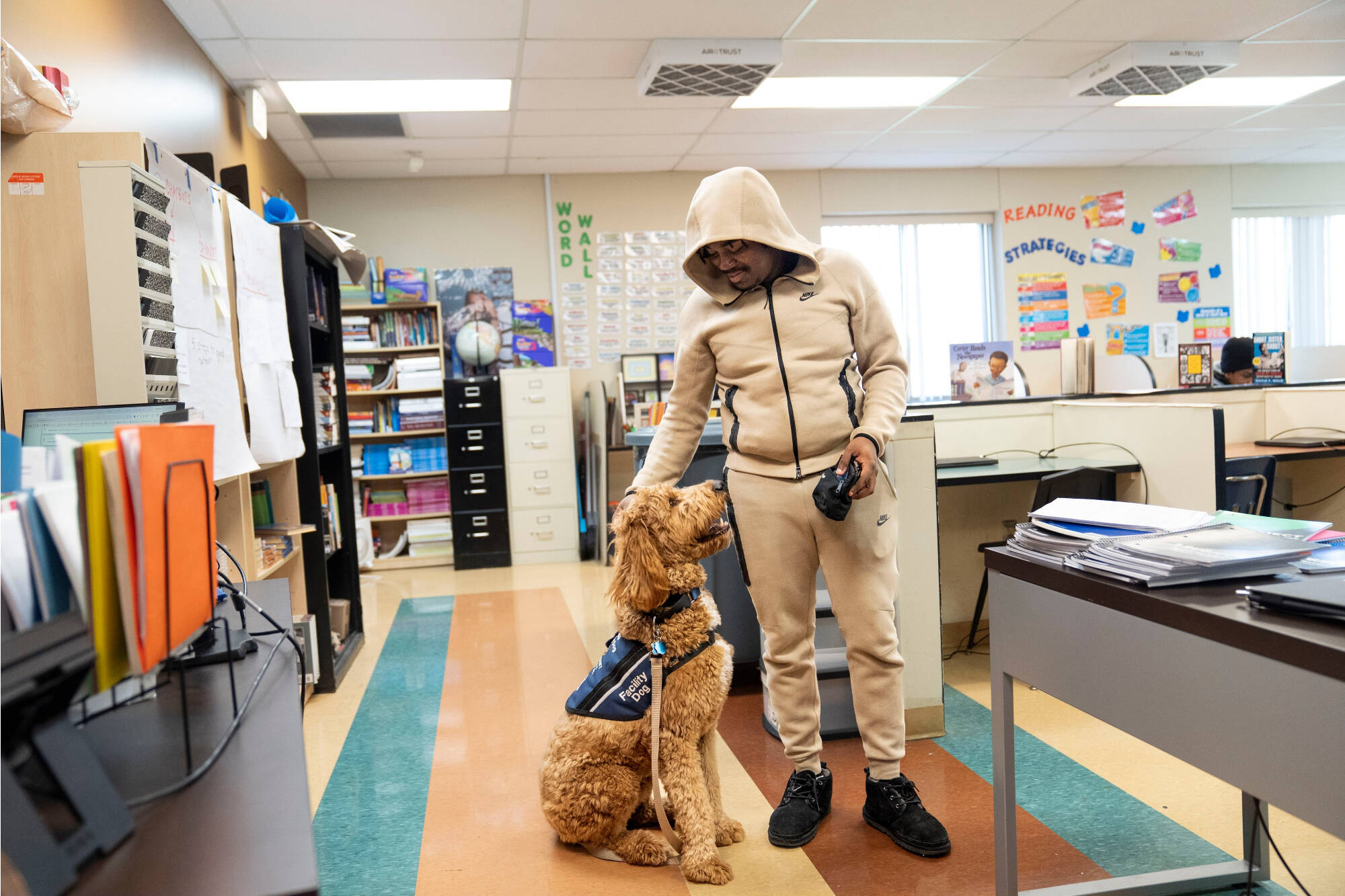 student petting Beau